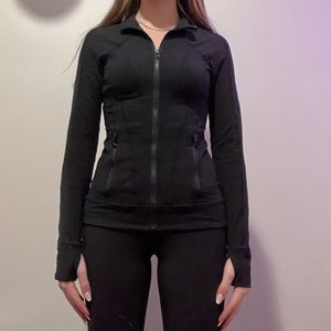 Fitted black athletic zip up with pockets